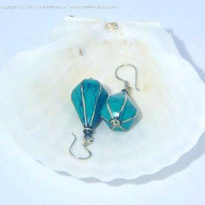 Pair of White Metal Earrings With Green Stone